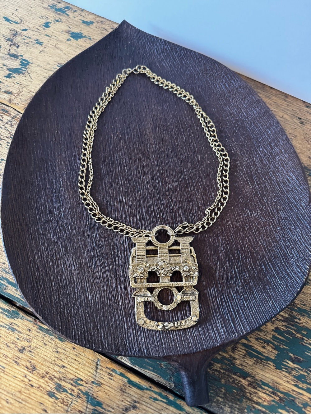 Gold-Tone Statement Necklace with Decorative Pendant